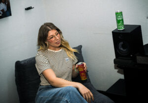 woman holding high spirit can, THC Beverages